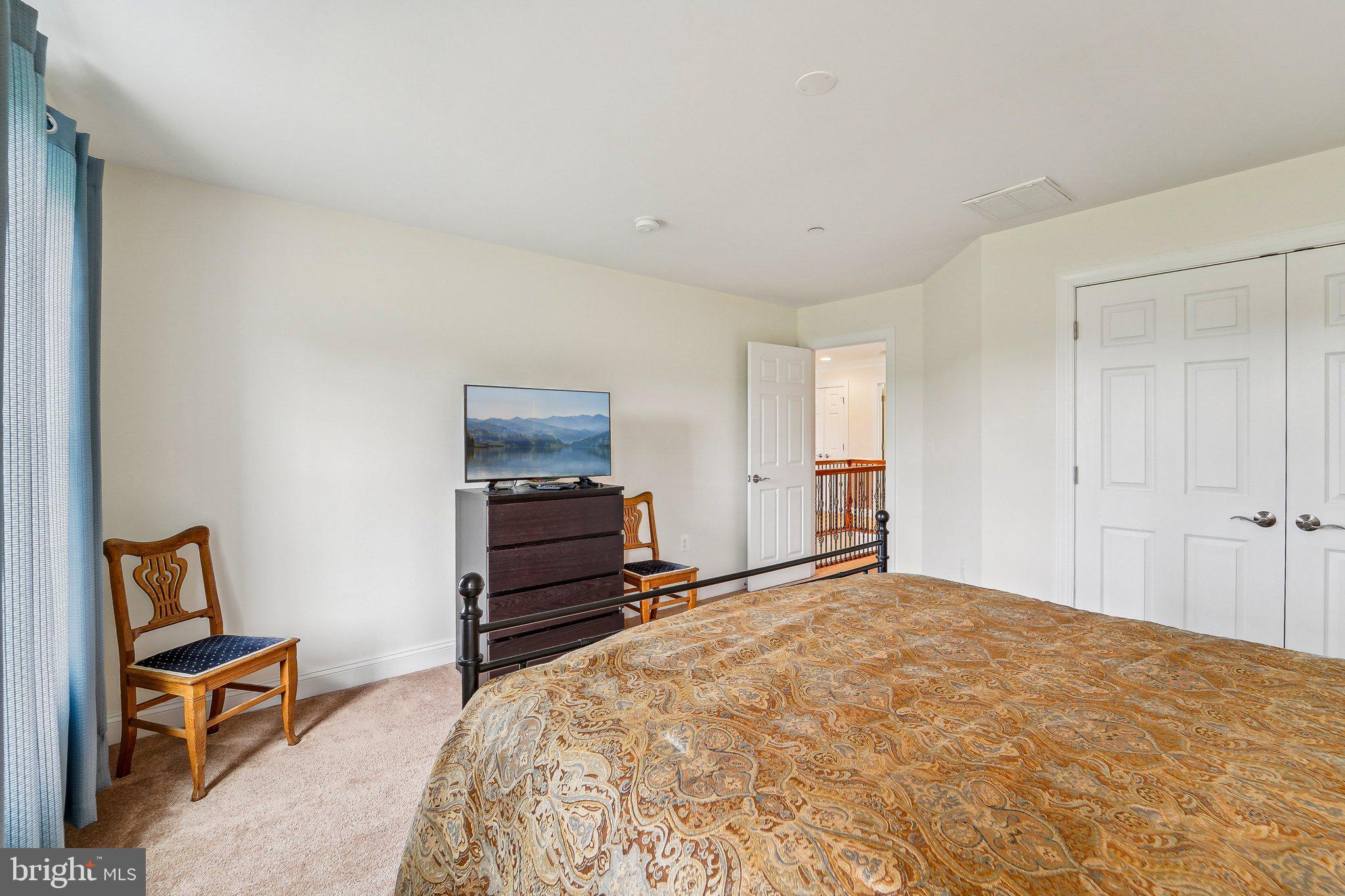 13936 Rover Mill Road West Friendship, MD 21794 - Photo 24 of 73 a bedroom with a bed and furniture