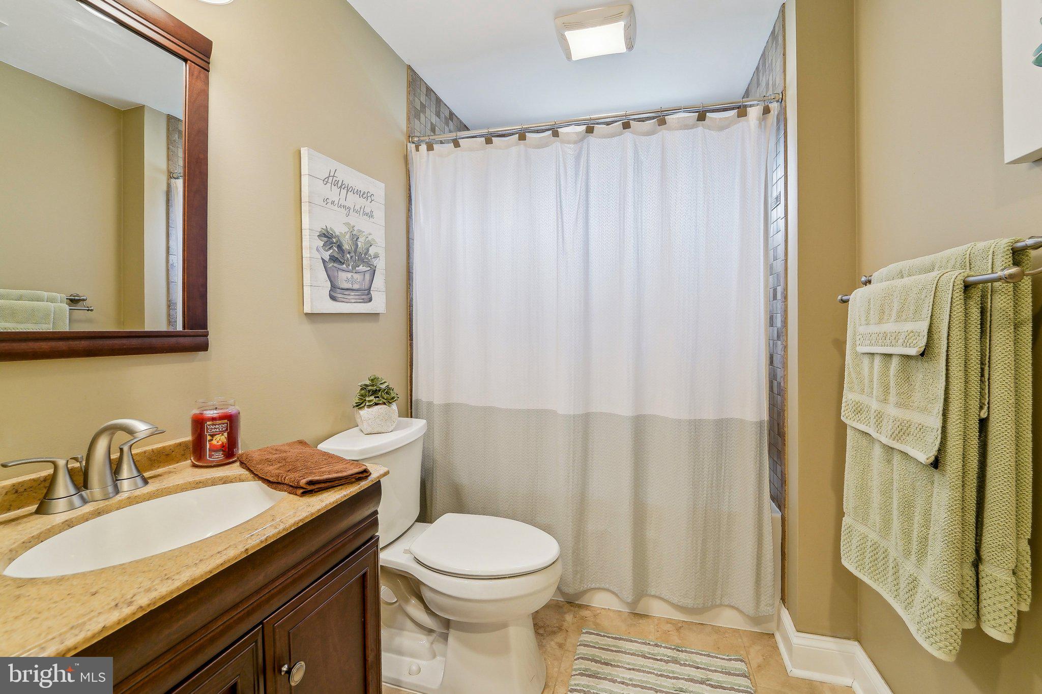 13936 Rover Mill Road West Friendship, MD 21794 - Photo 37 of 73 a bathroom with a sink and a mirror