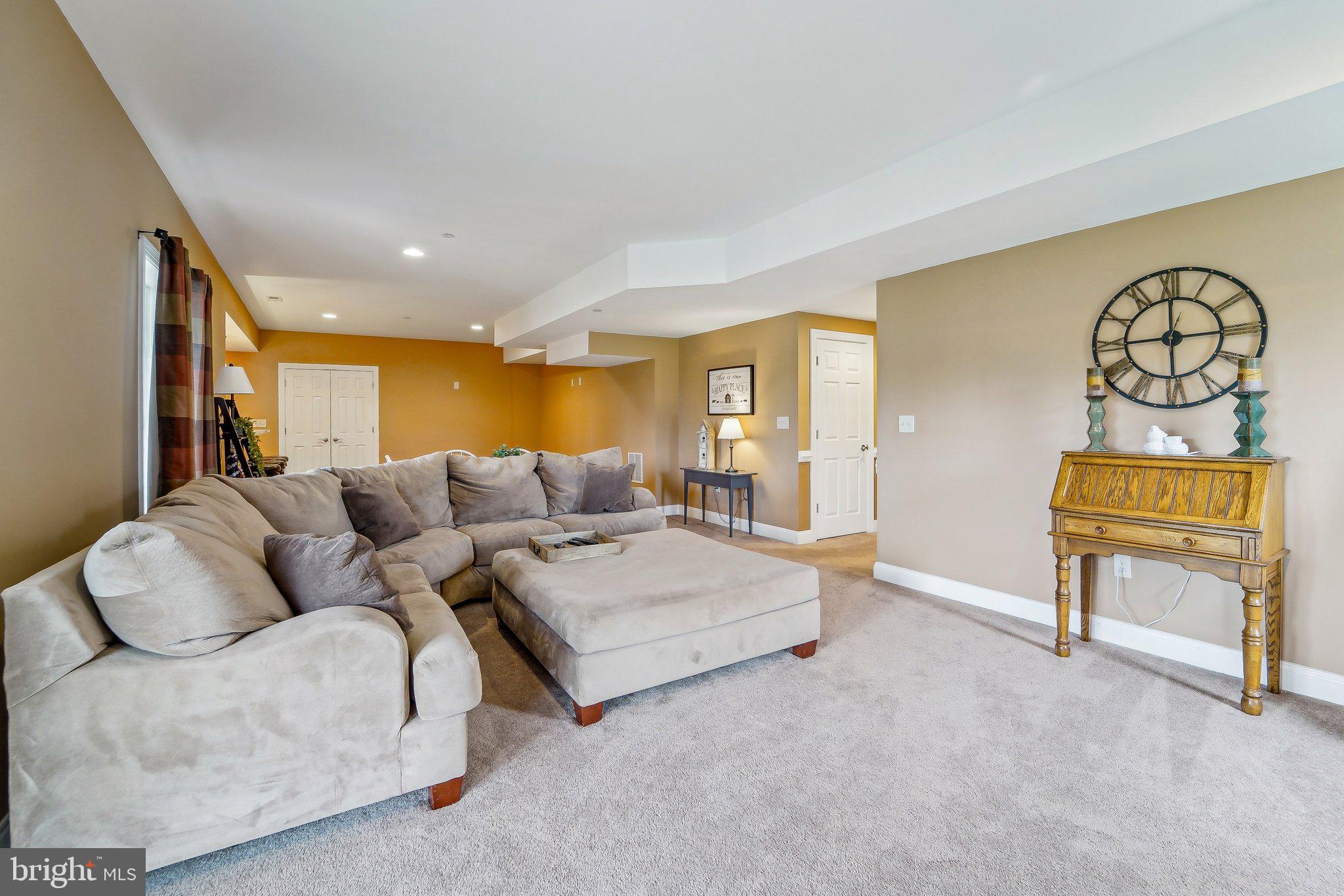 13936 Rover Mill Road West Friendship, MD 21794 - Photo 41 of 73 a living room with furniture and a wooden floor
