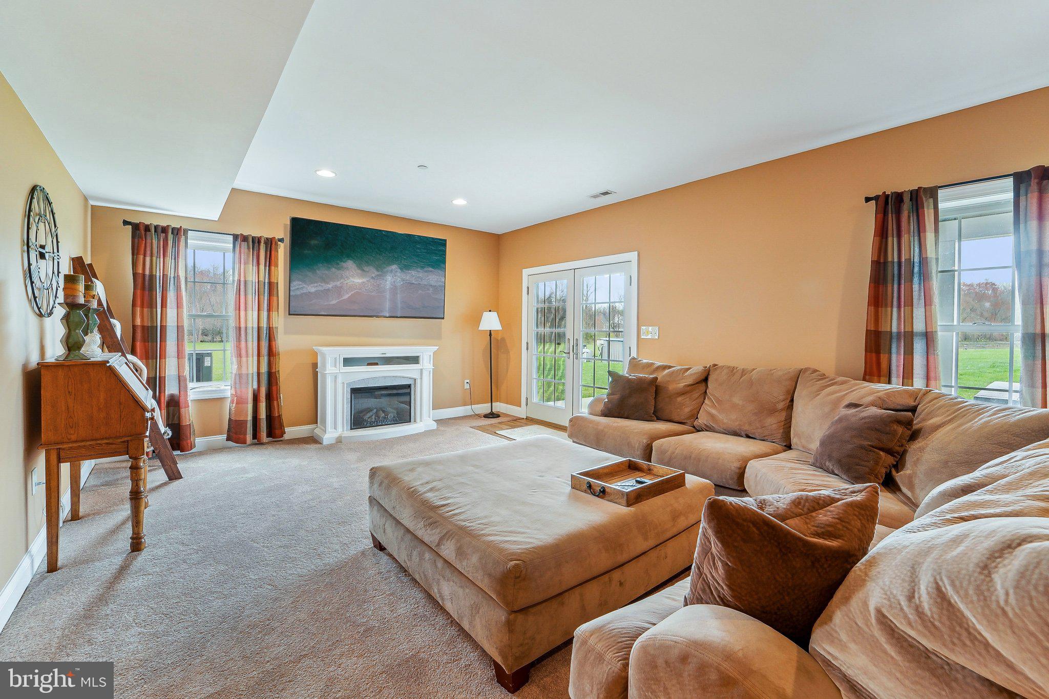 13936 Rover Mill Road West Friendship, MD 21794 - Photo 42 of 73 a living room with furniture fireplace and a large window