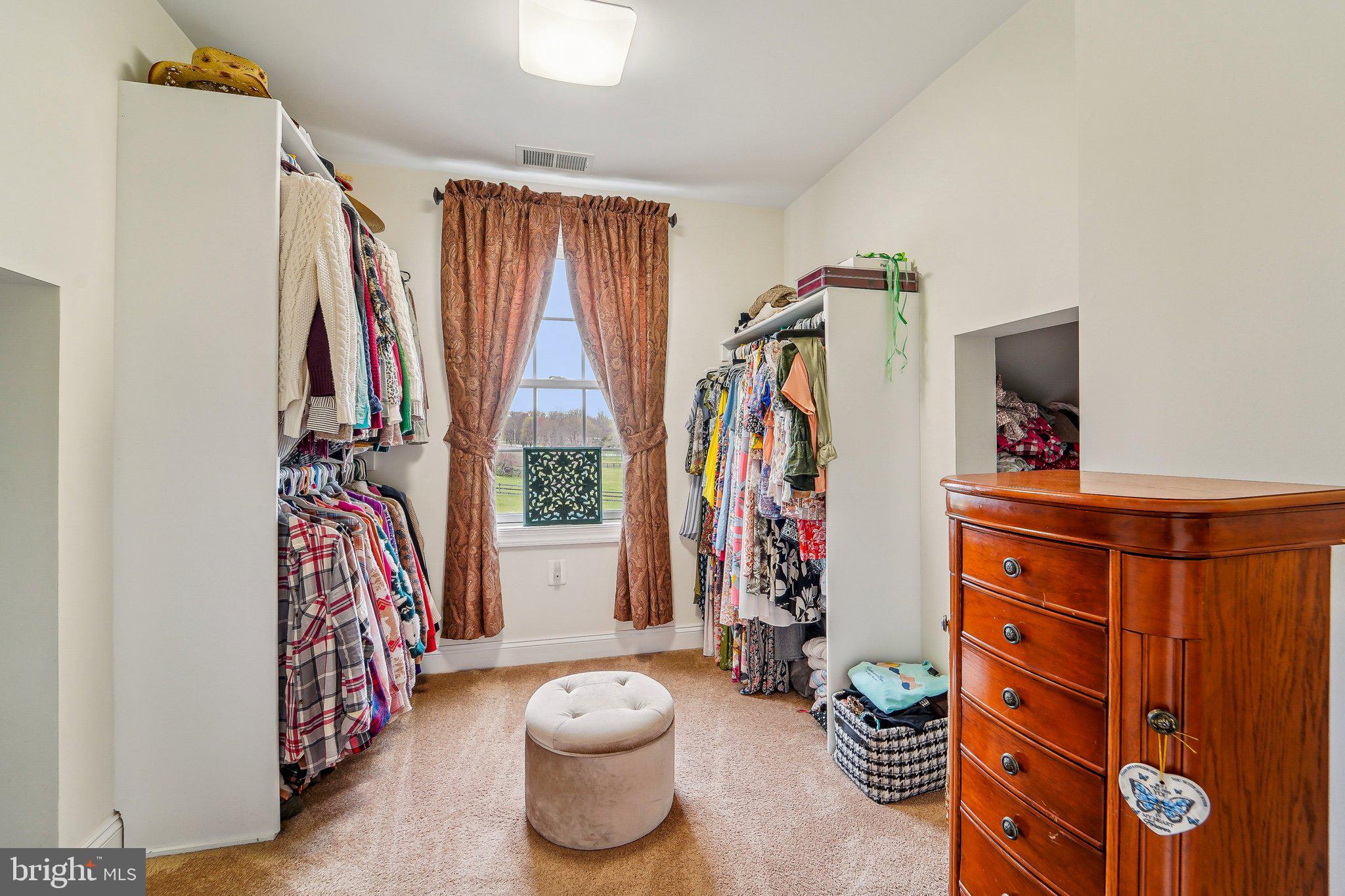 13936 Rover Mill Road West Friendship, MD 21794 - Photo 43 of 73 a view of walk in closet with clothes and shoes