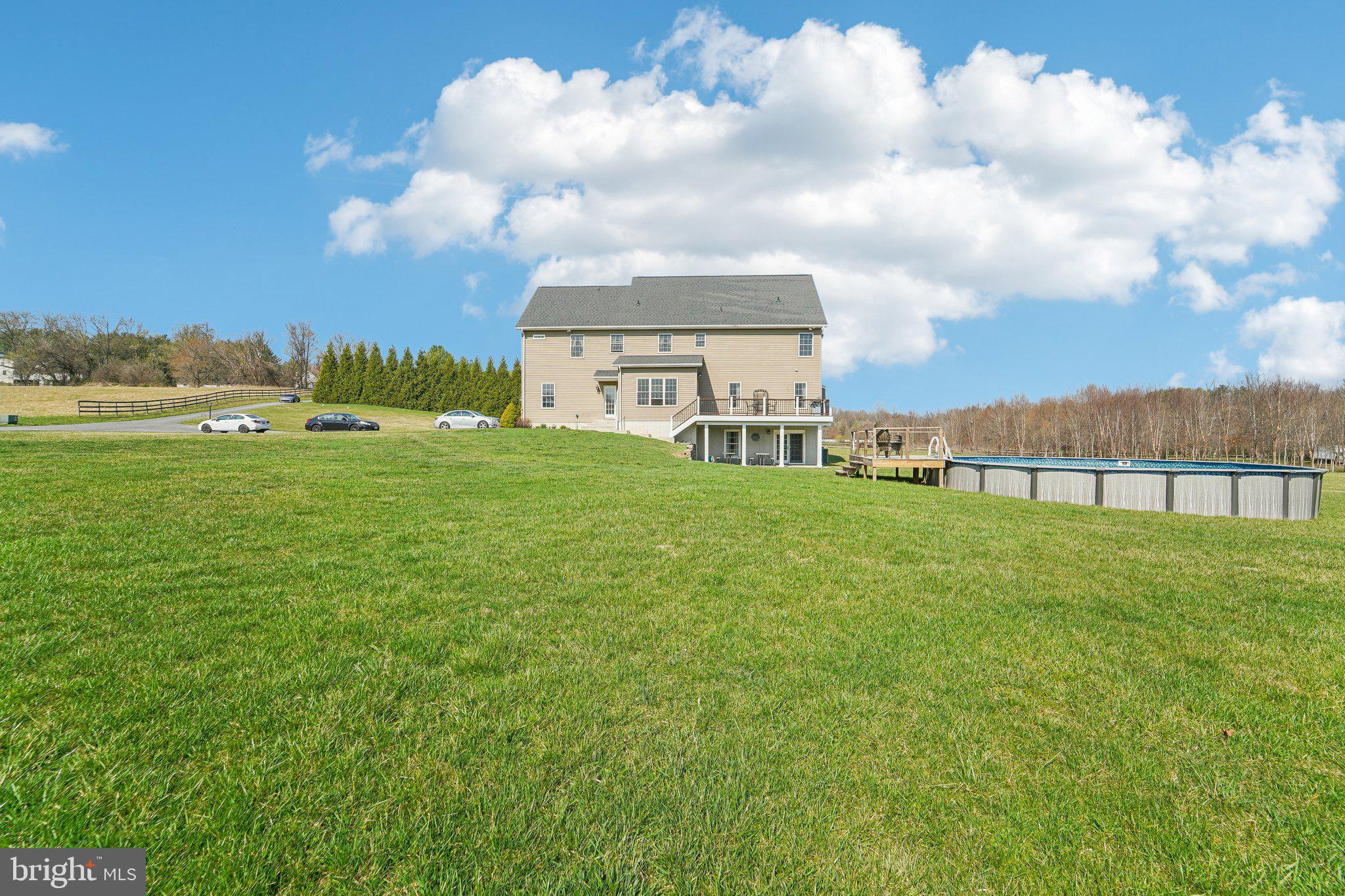 13936 Rover Mill Road West Friendship, MD 21794 - Photo 51 of 73 a view of a house with a big yard and a large tree