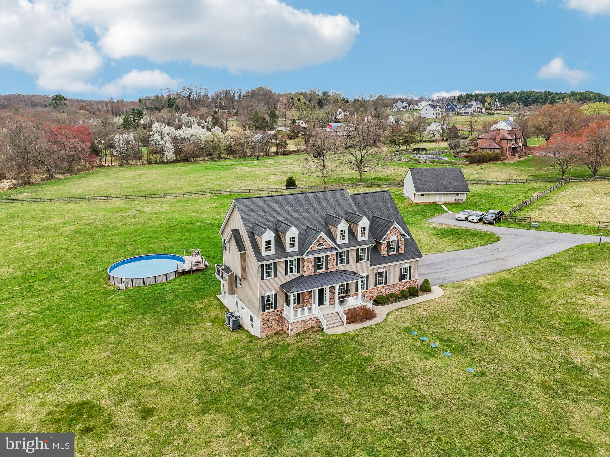 13936 Rover Mill Road West Friendship, MD 21794 - Photo 57 of 73 an aerial view of a house with a big yard