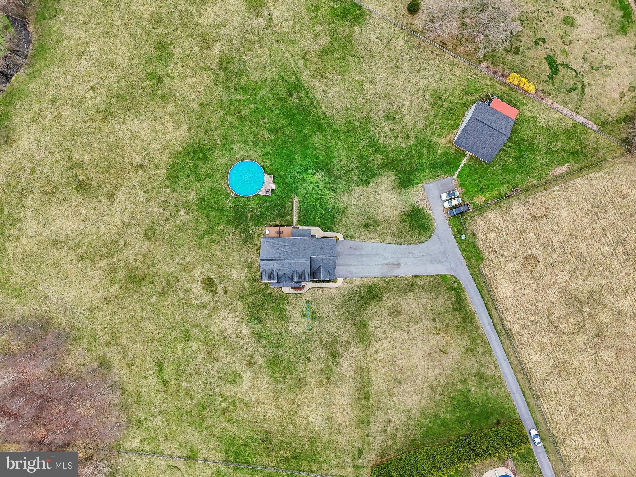 13936 Rover Mill Road West Friendship, MD 21794 - Photo 60 of 73 a backyard of a house with outdoor seating