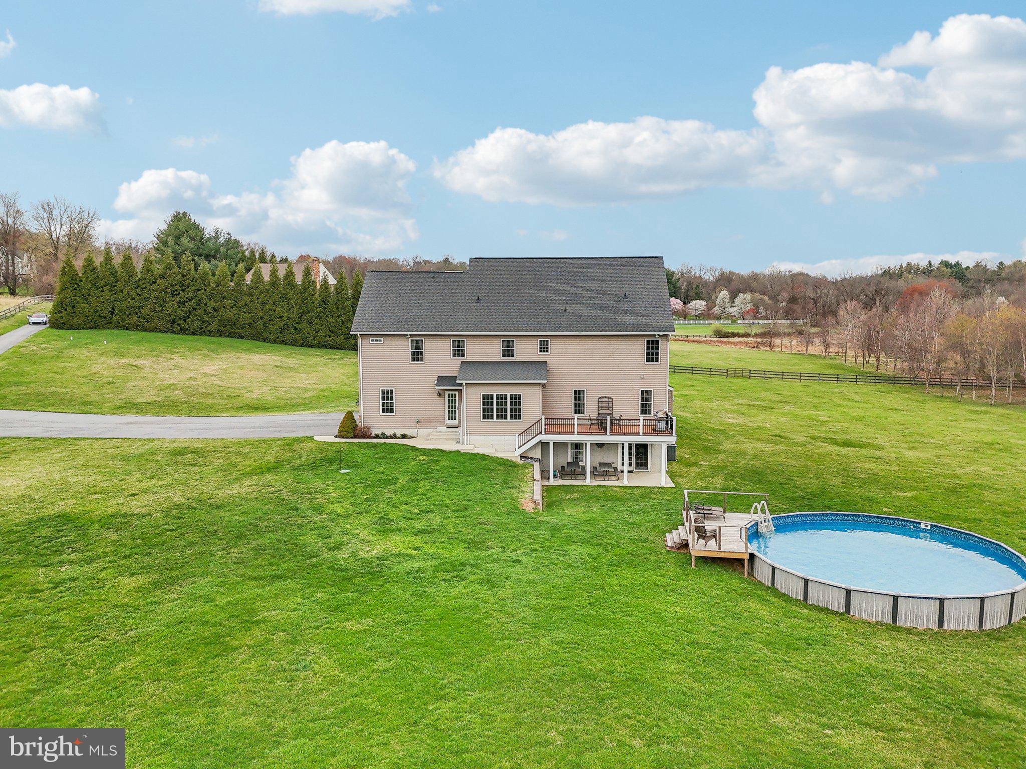 13936 Rover Mill Road West Friendship, MD 21794 - Photo 68 of 73 a view of a house with a big yard and a large pool