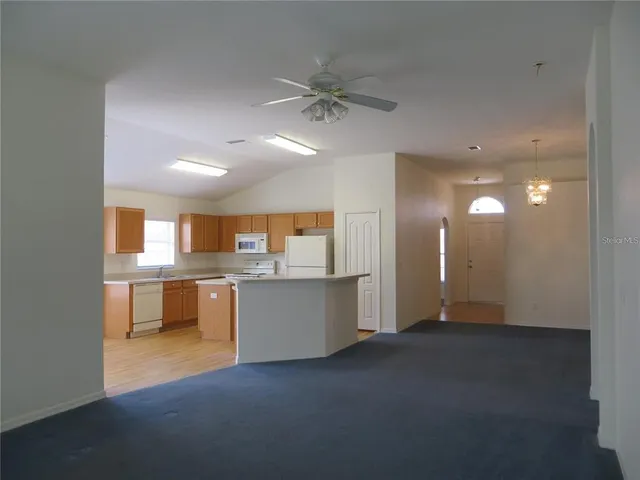 a view of a kitchen and a window