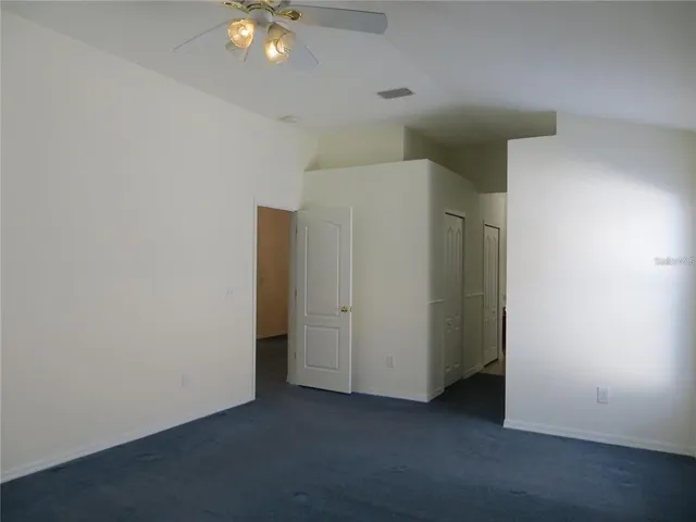 an empty room with closet area