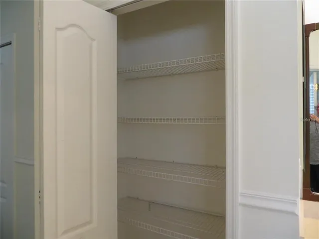 a view of a room with racks on the wall