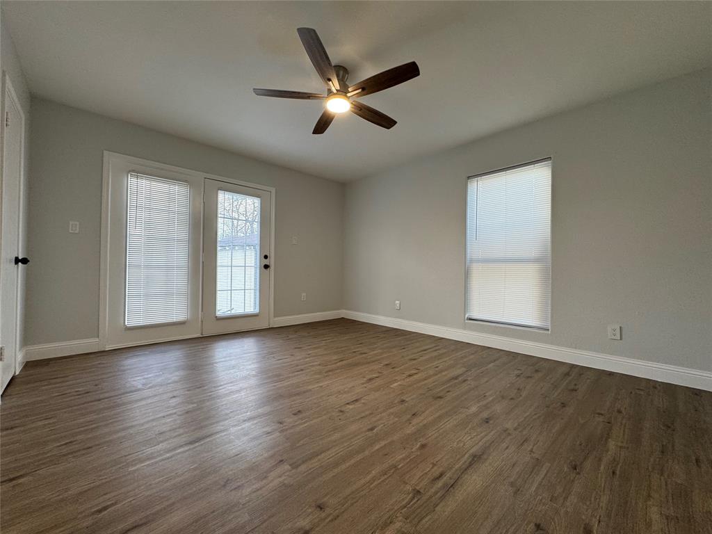 2909 Alexander Avenue Waco, TX 76708 - Photo 17 of 27 Unfurnished room with dark wood-type flooring and a ceiling fan