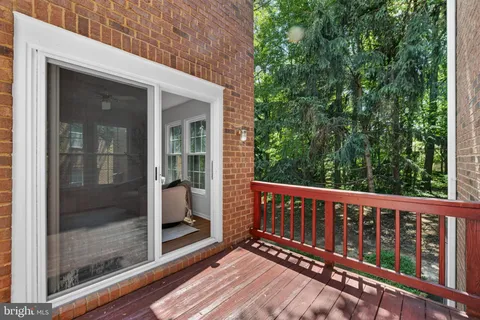 a view of a wooden deck with a backyard