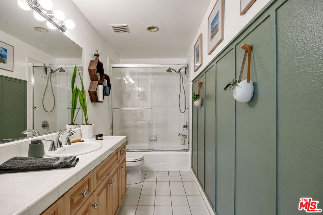 4400 Cartwright Avenue, Unit 102 North Hollywood, CA 91602 - Photo 11 of 21 a bathroom with a sink a toilet and shower