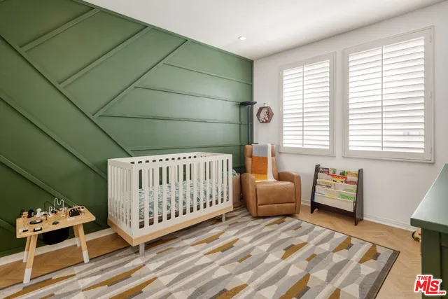 a bedroom with furniture and a window