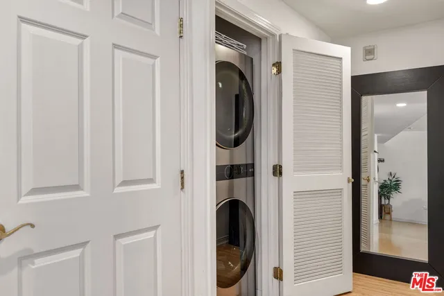 a close view of a utility room with dryer and washer