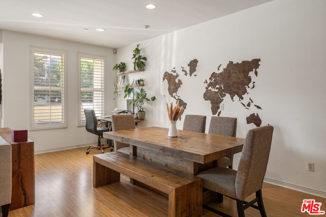 4400 Cartwright Avenue, Unit 102 North Hollywood, CA 91602 - Photo 5 of 21 a living room with furniture and wooden floor
