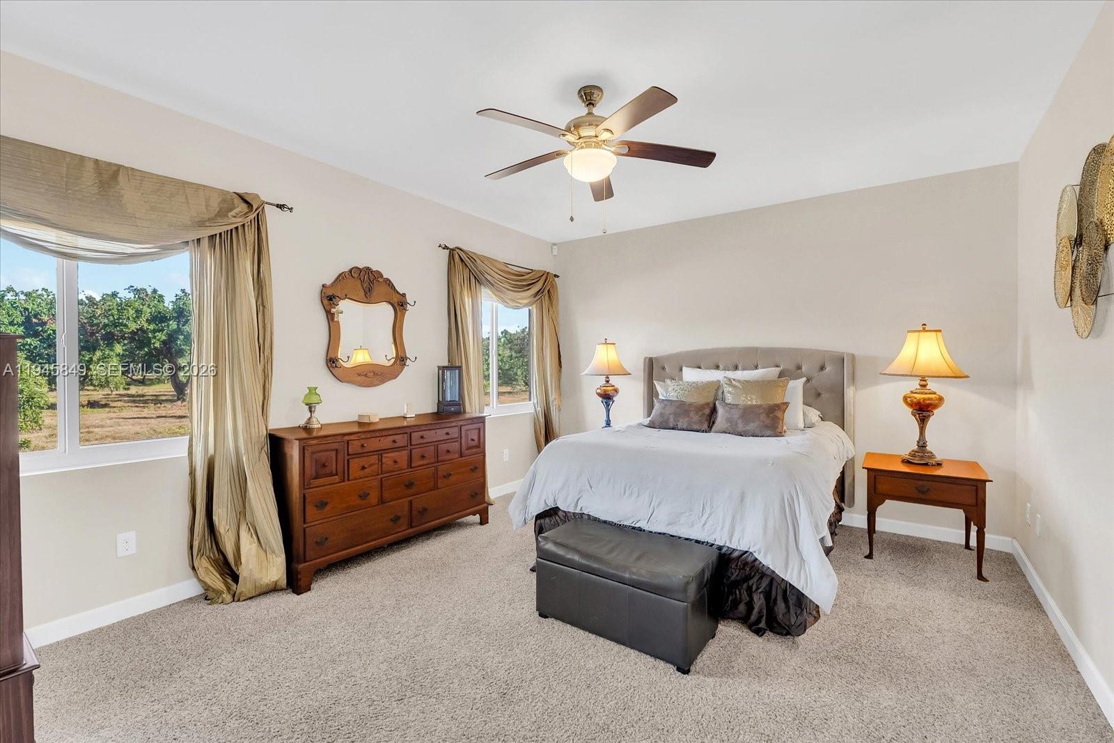 15150 Southwest 240th Street Homestead, FL 33032 - Photo 15 of 38 a bed room with a bed and a window