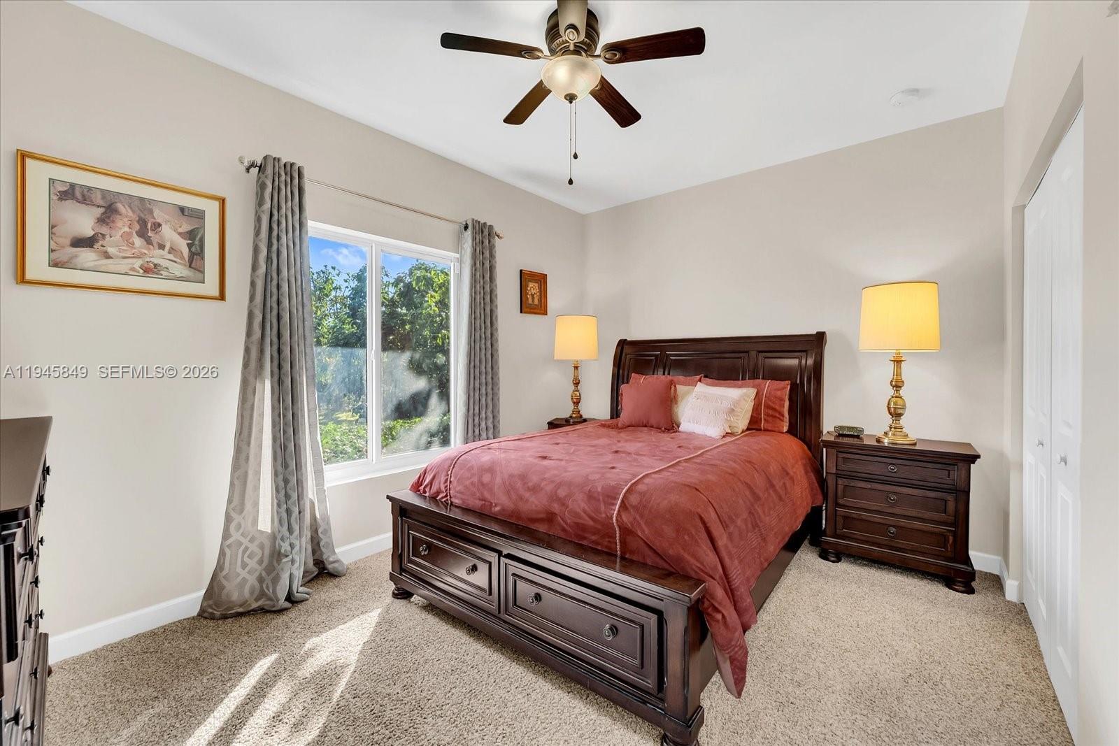 15150 Southwest 240th Street Homestead, FL 33032 - Photo 20 of 38 a bed room with a bed and a window