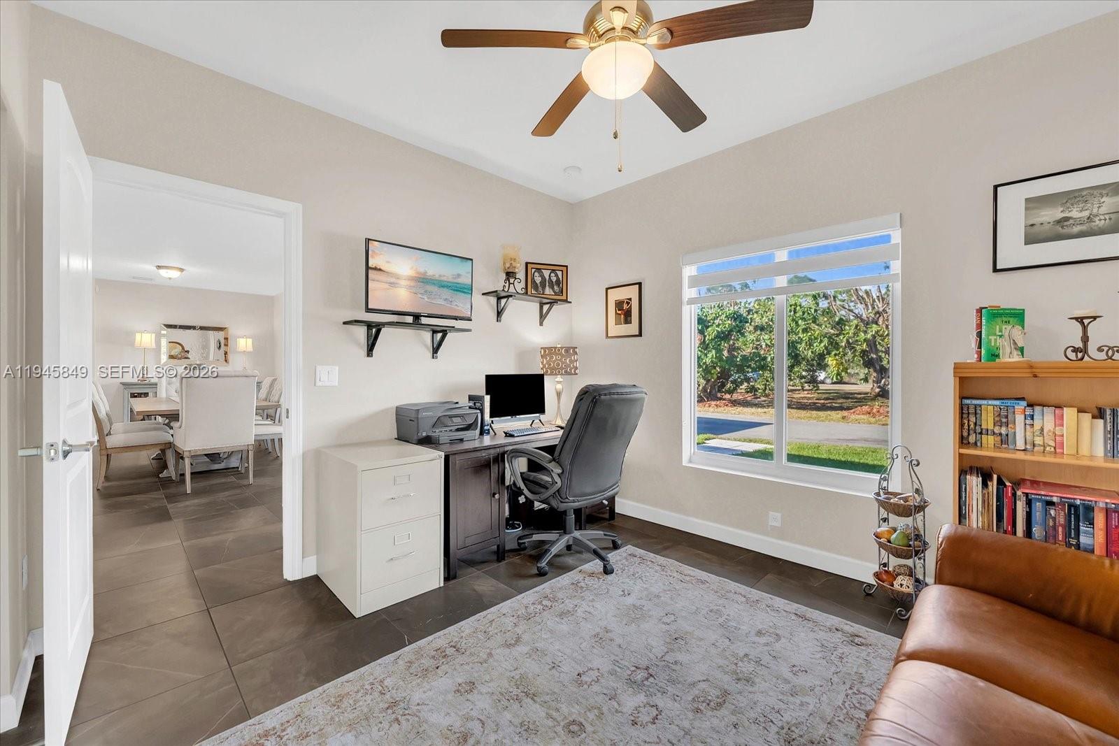 15150 Southwest 240th Street Homestead, FL 33032 - Photo 26 of 38 a view of a livingroom with workspace and a window