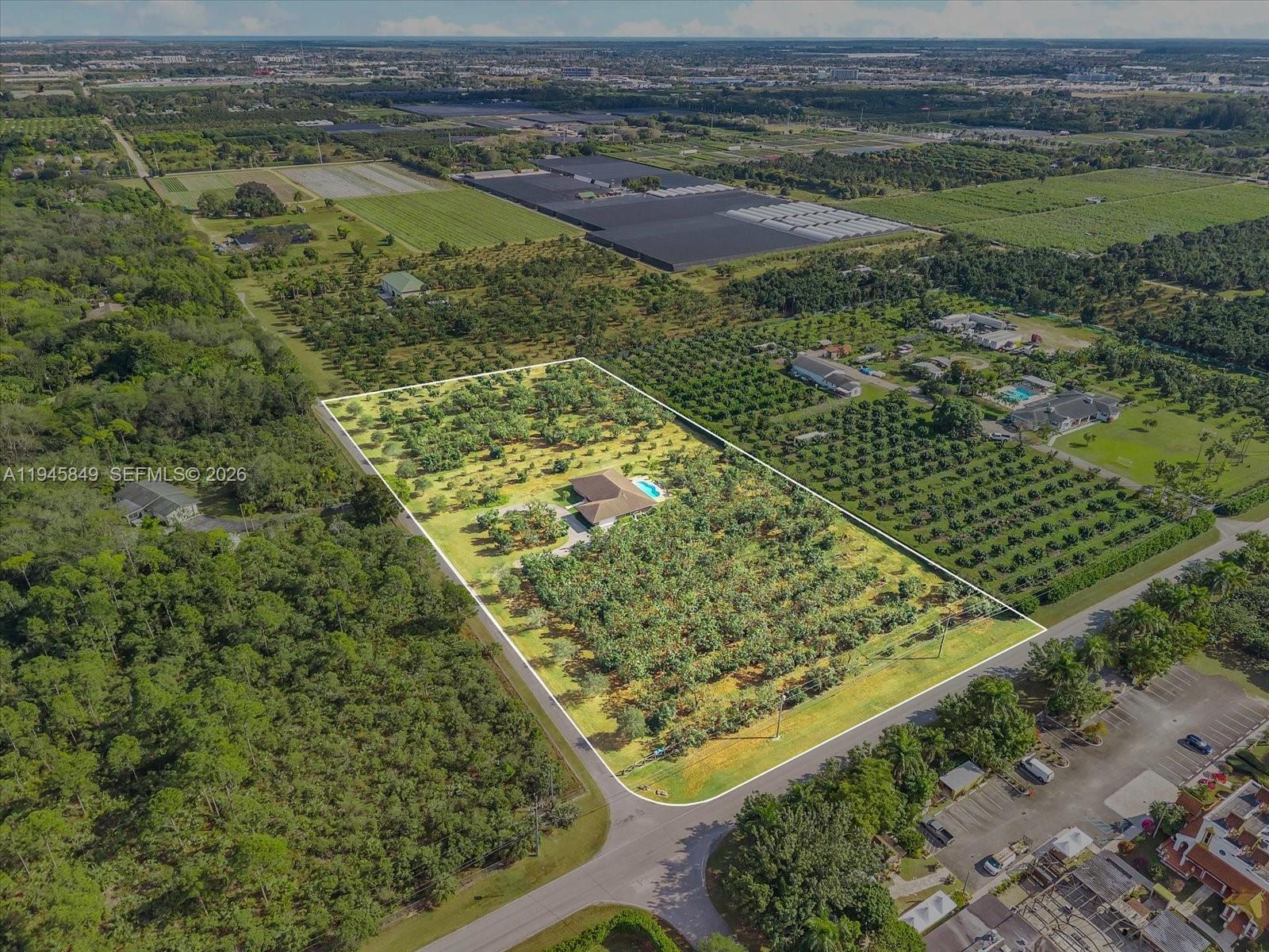 15150 Southwest 240th Street Homestead, FL 33032 - Photo 32 of 38 a view of a yard with an outdoor seating