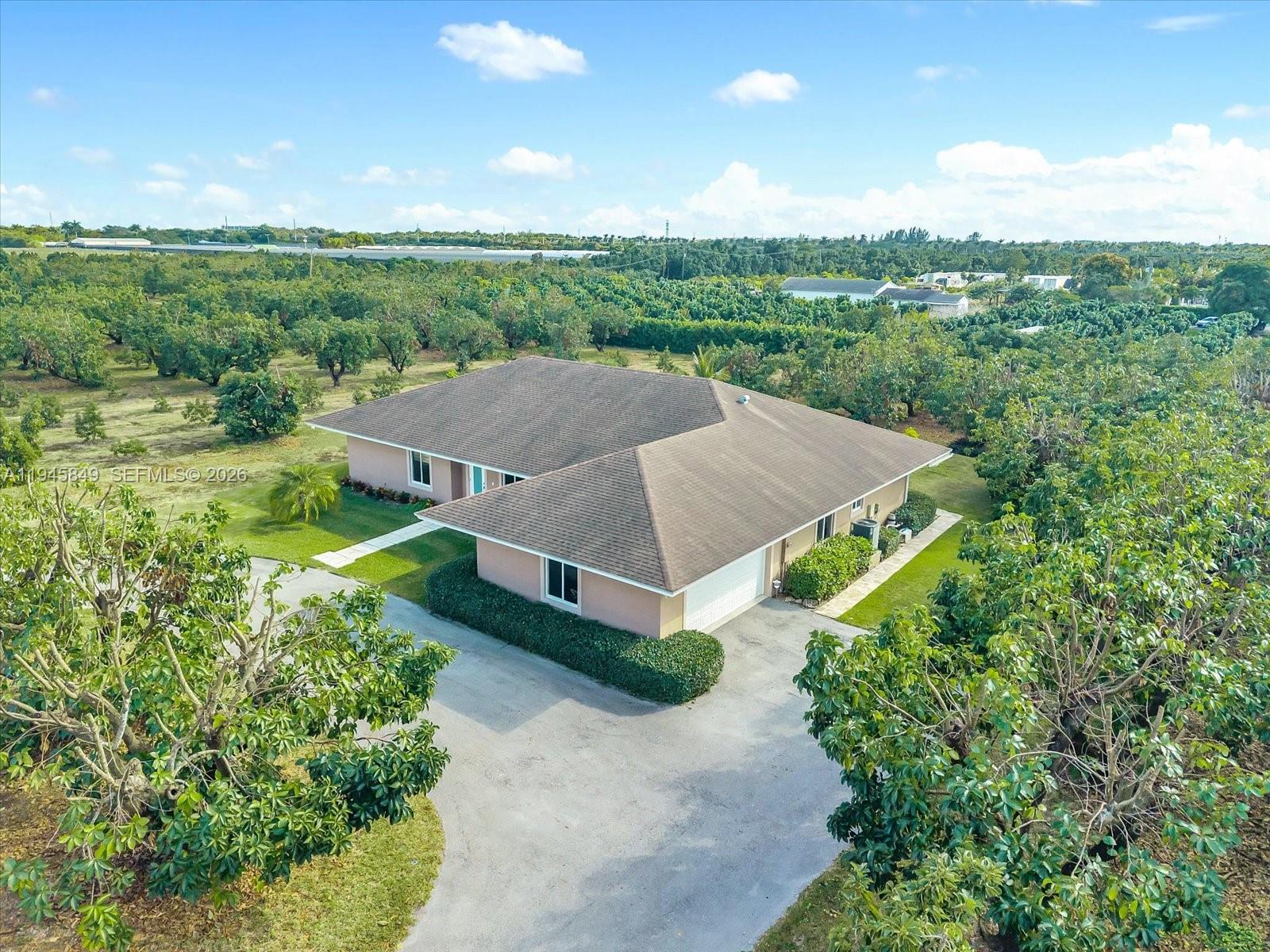 15150 Southwest 240th Street Homestead, FL 33032 - Photo 4 of 38 an aerial view of a house