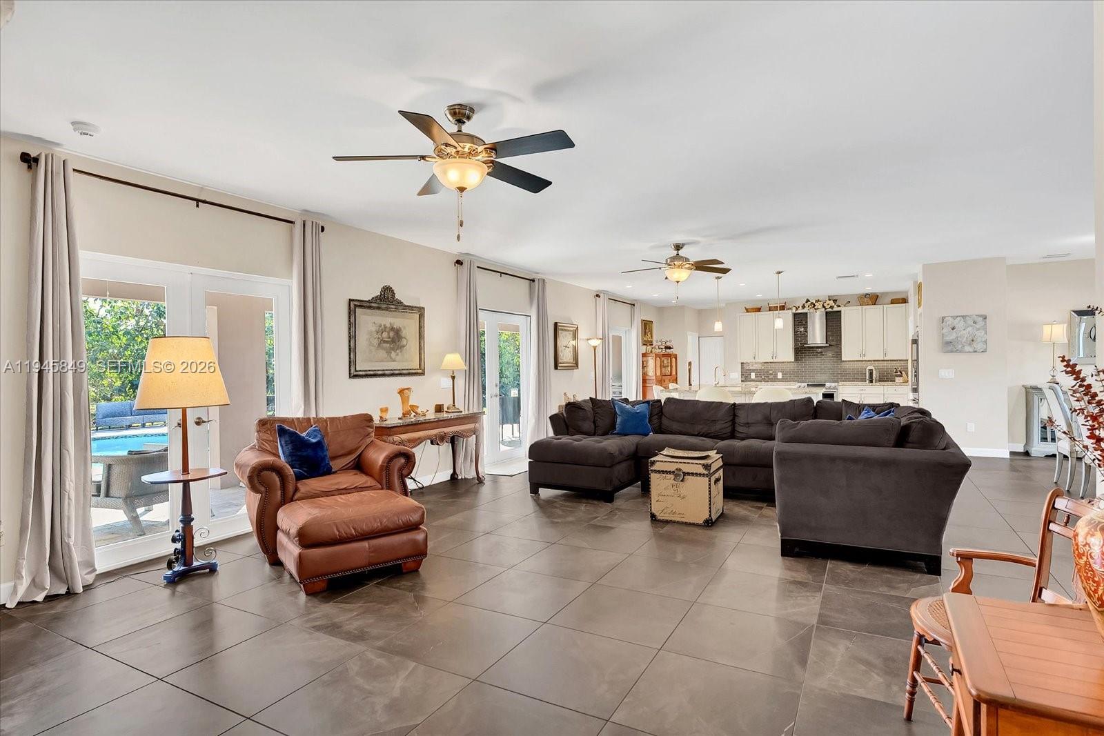 15150 Southwest 240th Street Homestead, FL 33032 - Photo 5 of 38 a living room with furniture and a window