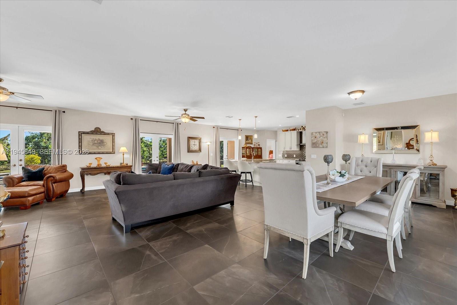 15150 Southwest 240th Street Homestead, FL 33032 - Photo 8 of 38 a living room with furniture and a wooden floor