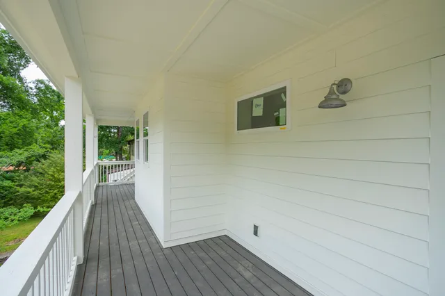 a view of a balcony with wooden floor
