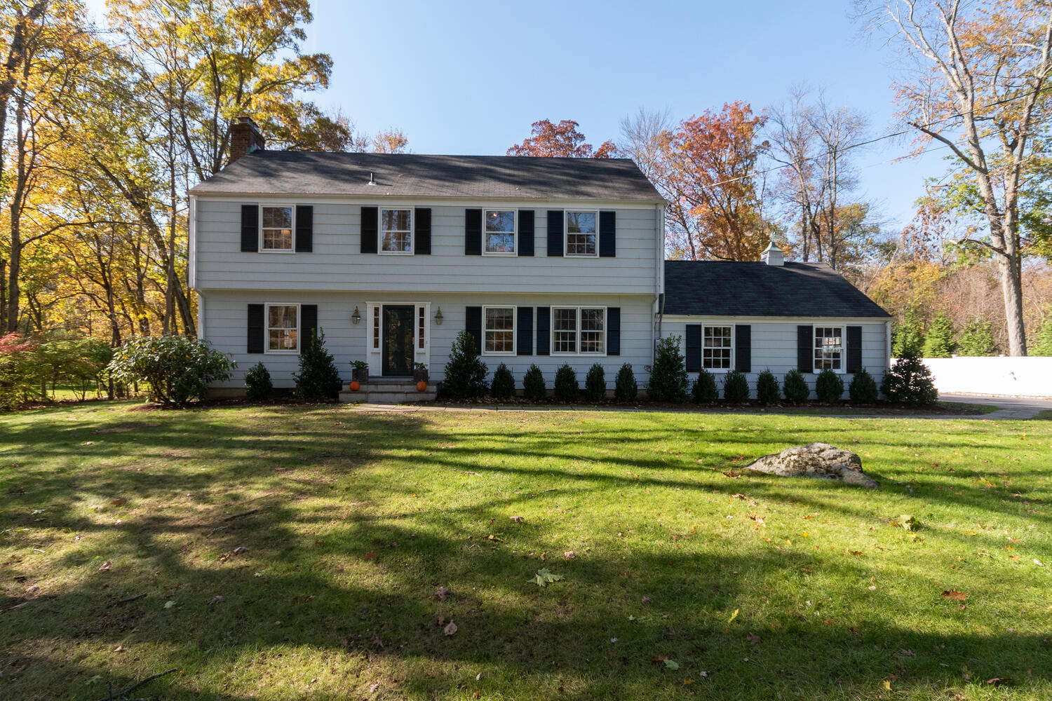 297 Brookside Road Darien, CT 06820 - Photo 1 of 63 a front view of a house with a swimming pool