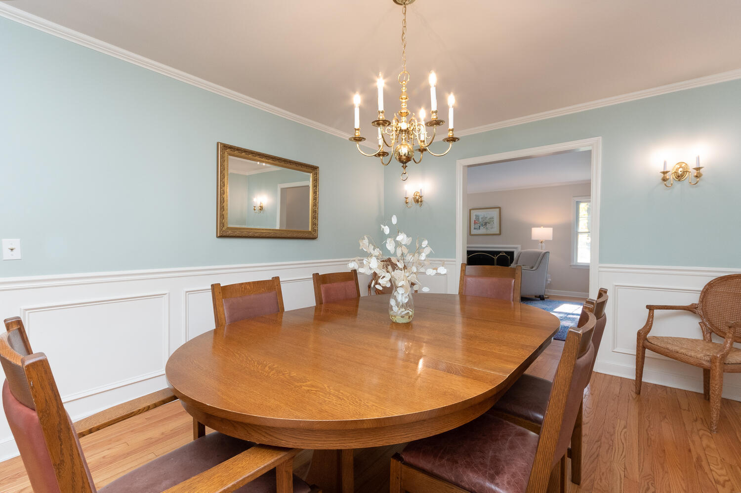 297 Brookside Road Darien, CT 06820 - Photo 13 of 63 a dining room with furniture a chandelier and wooden floor