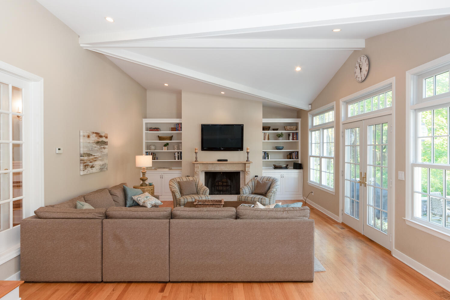 297 Brookside Road Darien, CT 06820 - Photo 17 of 63 a living room with furniture a flat screen tv and a fireplace