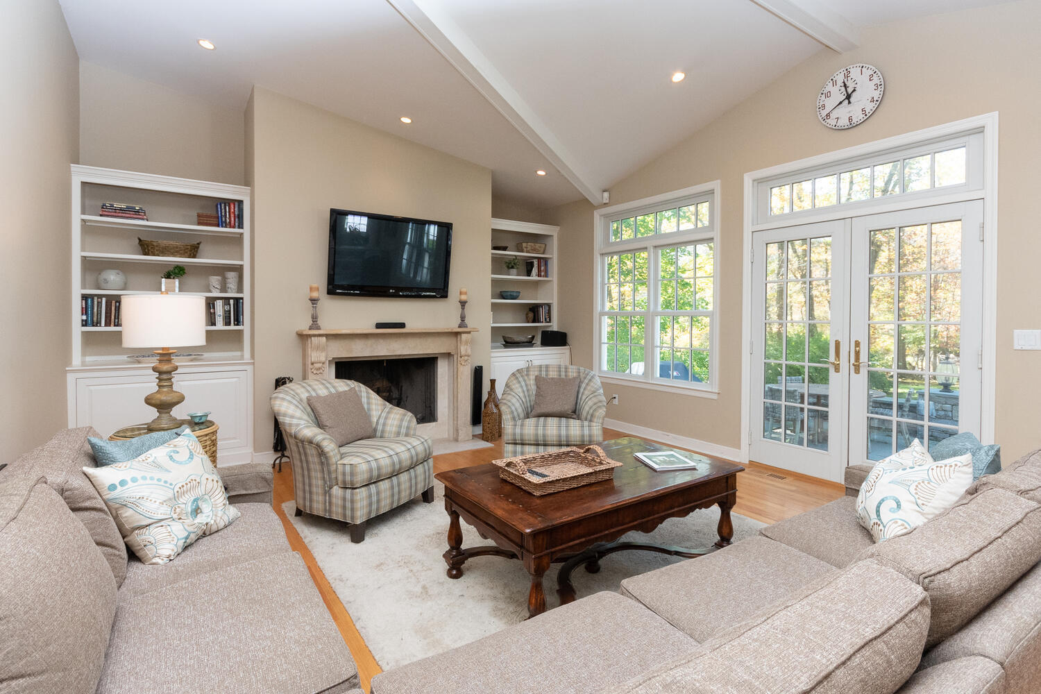 297 Brookside Road Darien, CT 06820 - Photo 23 of 63 a living room with furniture a flat screen tv and a fireplace
