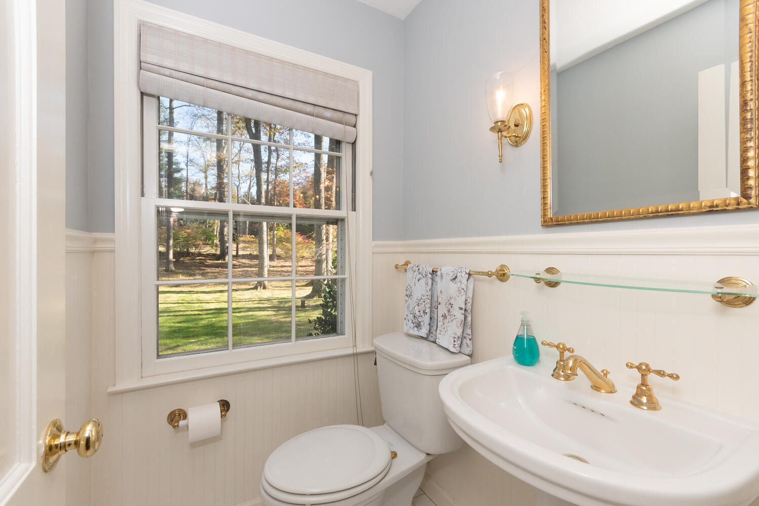 297 Brookside Road Darien, CT 06820 - Photo 29 of 63 a bathroom with a sink a toilet and a mirror