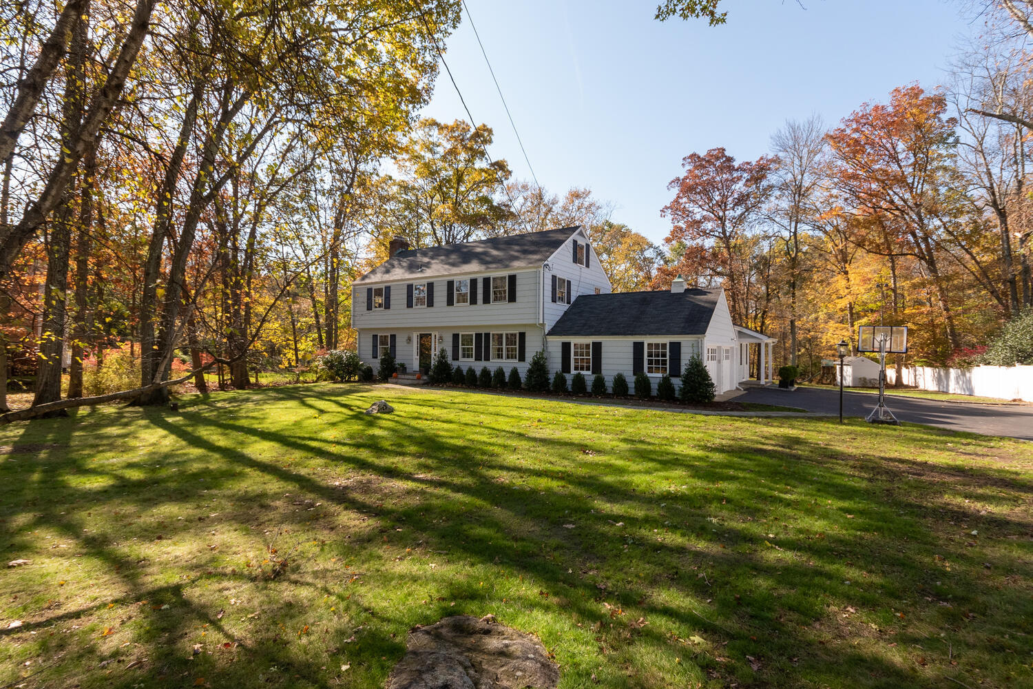 297 Brookside Road Darien, CT 06820 - Photo 4 of 63 a view of a house with a big yard with large trees