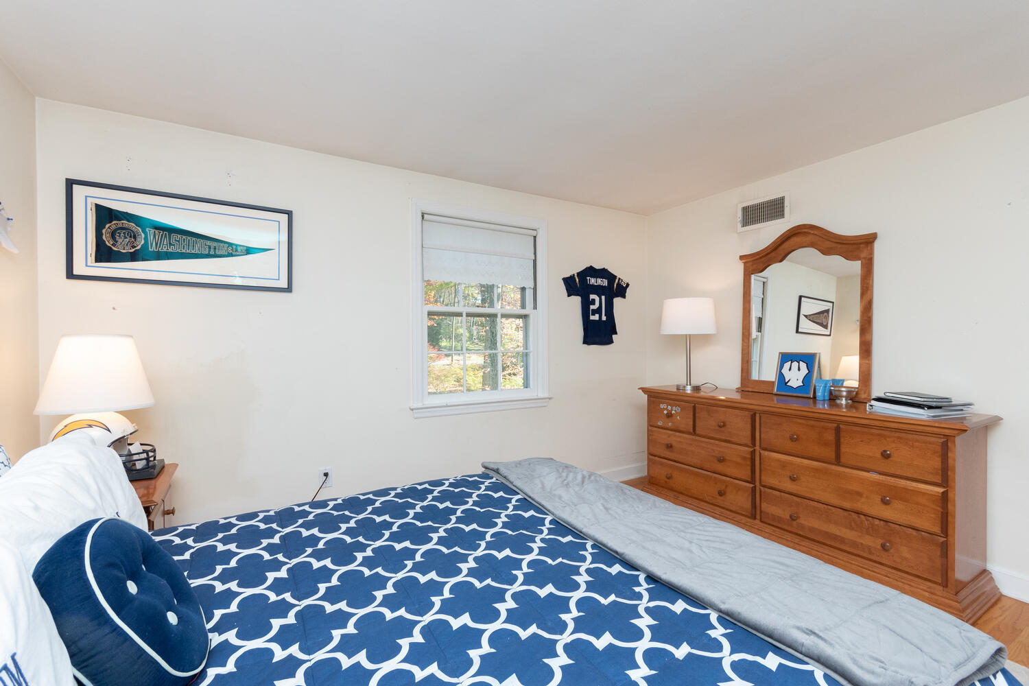 297 Brookside Road Darien, CT 06820 - Photo 36 of 63 a bedroom with a bed and wooden floor