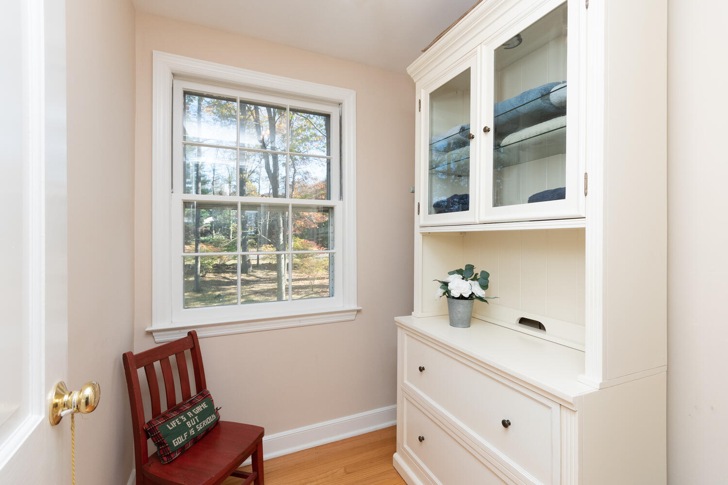 297 Brookside Road Darien, CT 06820 - Photo 37 of 63 a hallway with a window and couch