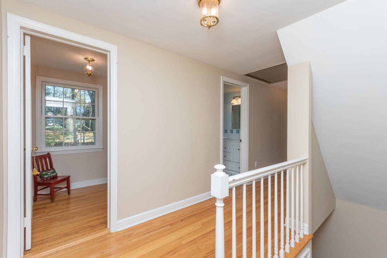 297 Brookside Road Darien, CT 06820 - Photo 43 of 63 a view of a hallway and a livingroom with wooden floor