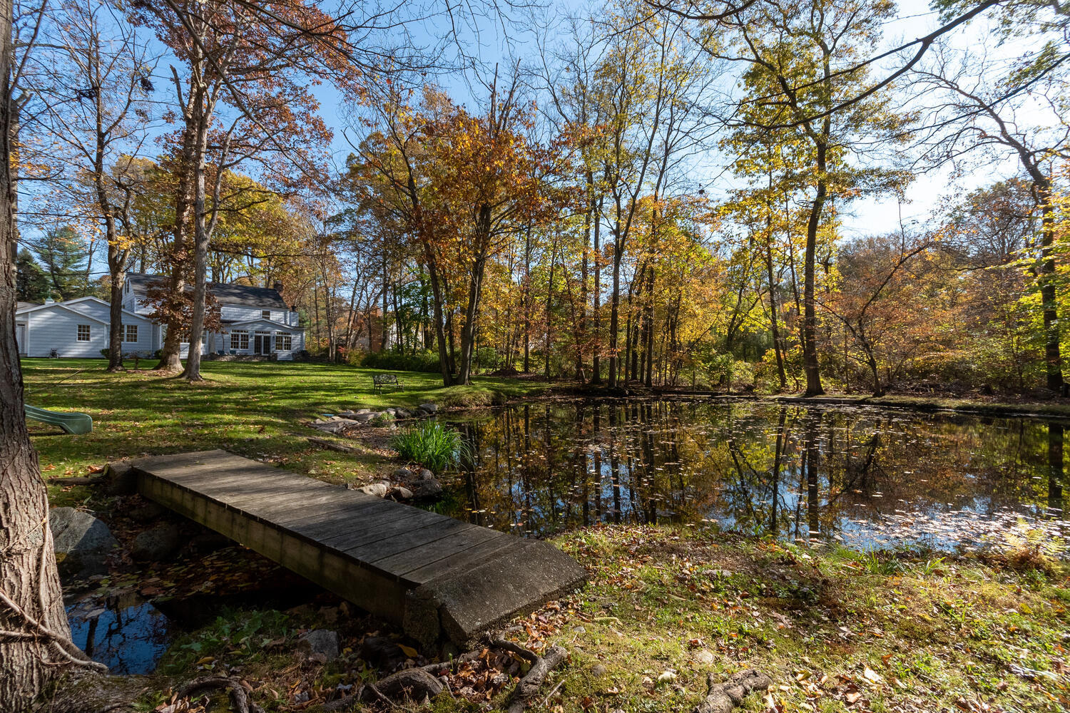 297 Brookside Road Darien, CT 06820 - Photo 56 of 63 a view of a yard with wooden fence