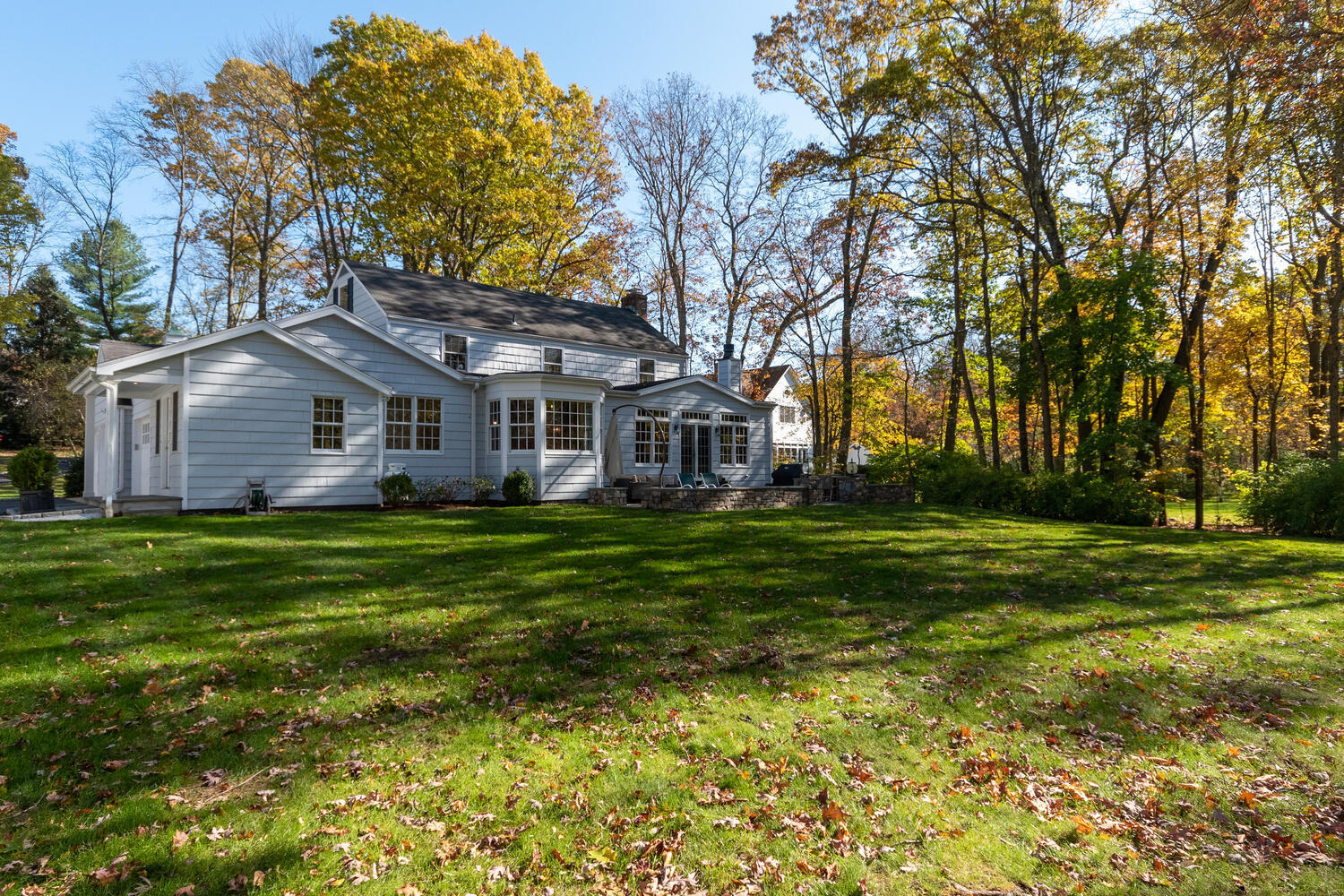 297 Brookside Road Darien, CT 06820 - Photo 59 of 63 a front view of a house with a garden