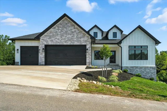 a view of a livingroom with furniture and hardwood floor
