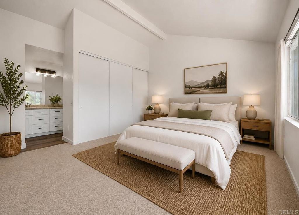 4595 Blackwell Road Oceanside, CA 92056 - Photo 27 of 47 a bedroom with a bed and a couch