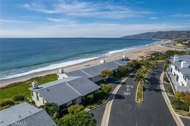 a view of a yard and ocean view