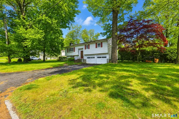 a view of a house with a big yard