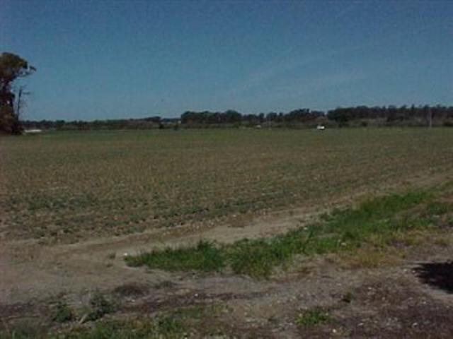 0 West Central Avenue Lompoc, CA 93436 - Photo 1 of 1 a view of a lake with houses in the back