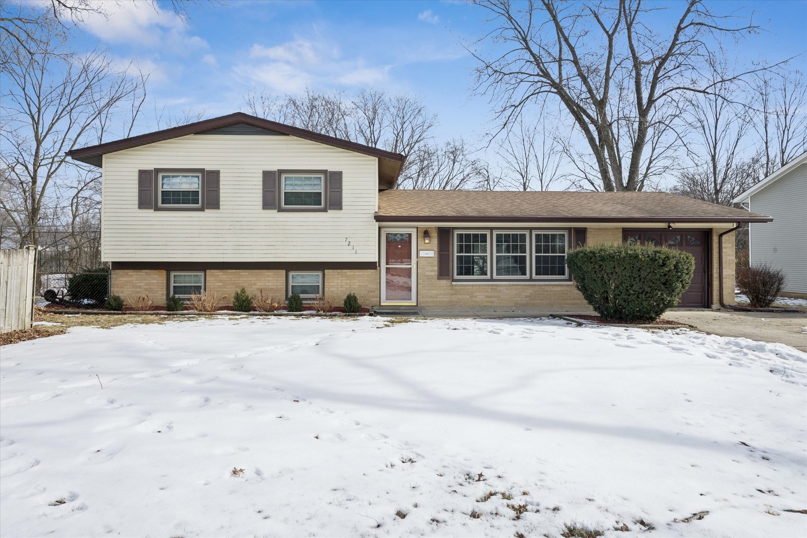 7211 Longmeadow Lane Hanover Park, IL 60133 - Photo 1 of 19 a front view of a house with a yard