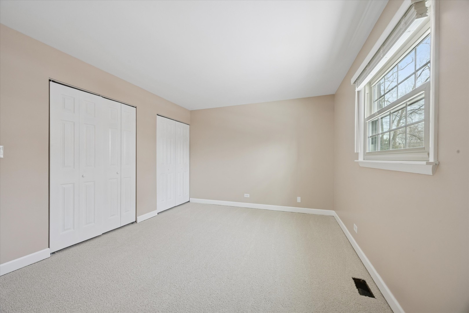 7211 Longmeadow Lane Hanover Park, IL 60133 - Photo 12 of 19 an empty room with windows