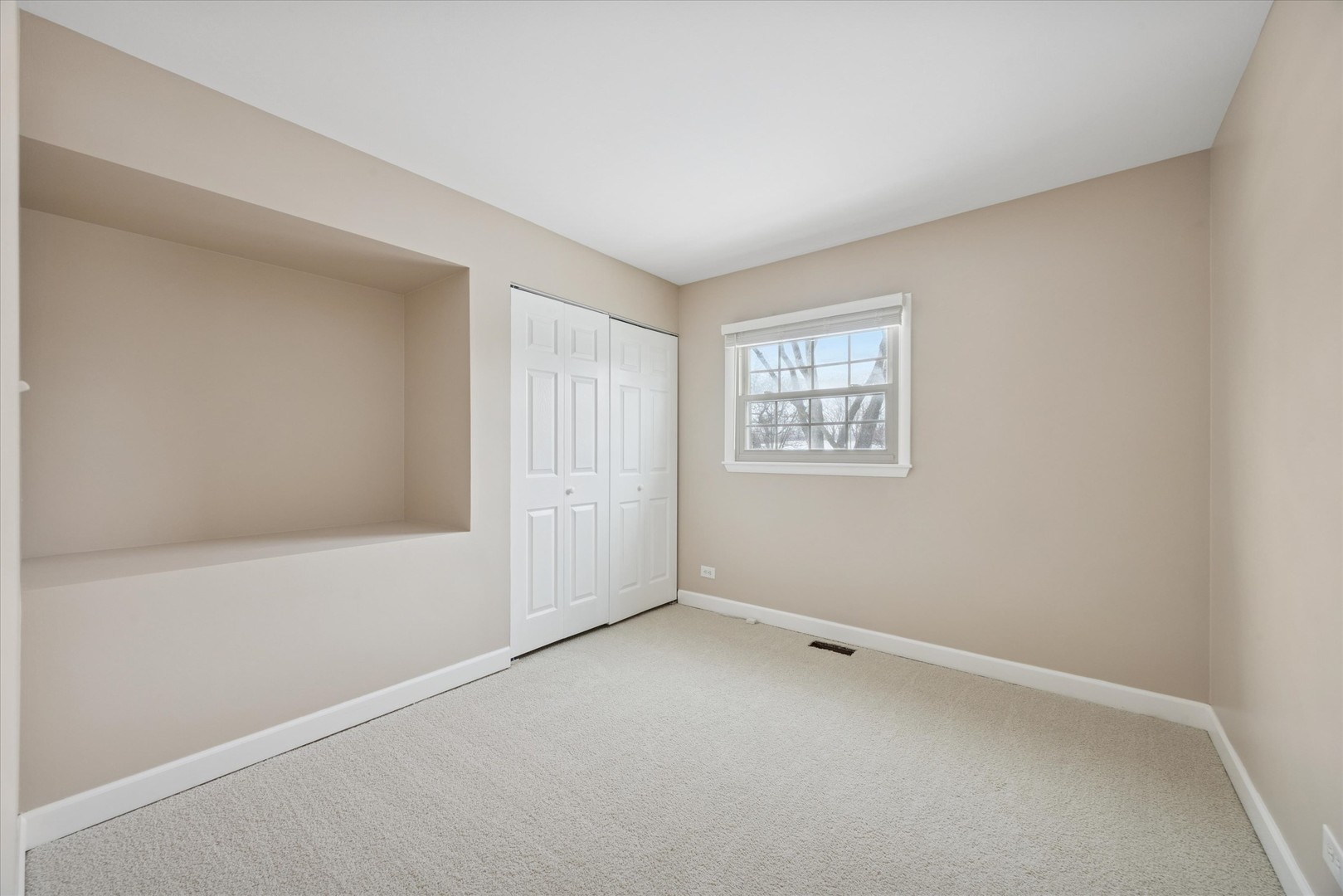 7211 Longmeadow Lane Hanover Park, IL 60133 - Photo 14 of 19 an empty room with windows