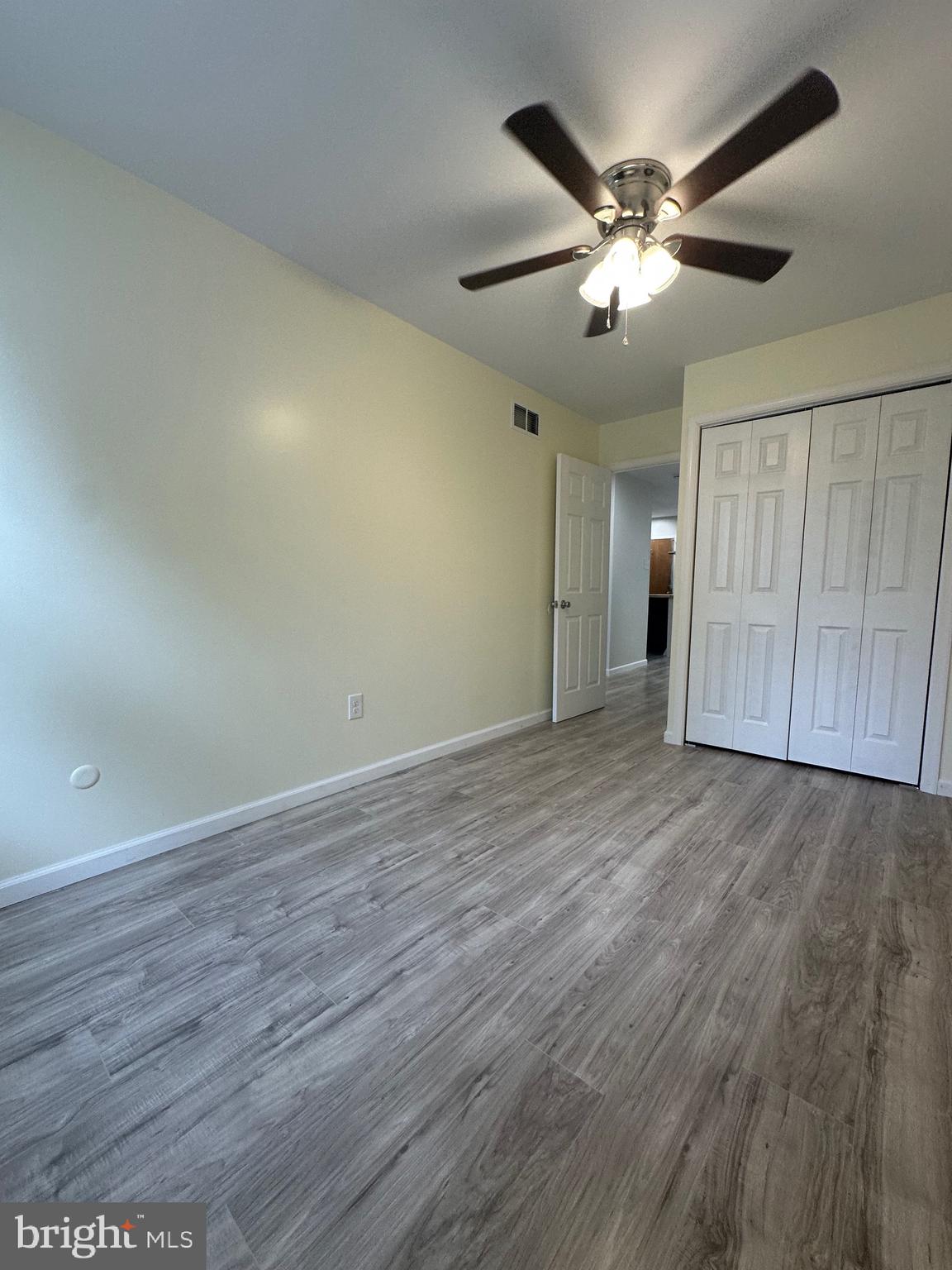 12070 Abby Road, Unit 1 Philadelphia, PA 19154 - Photo 13 of 22 a view of an empty room with wooden floor