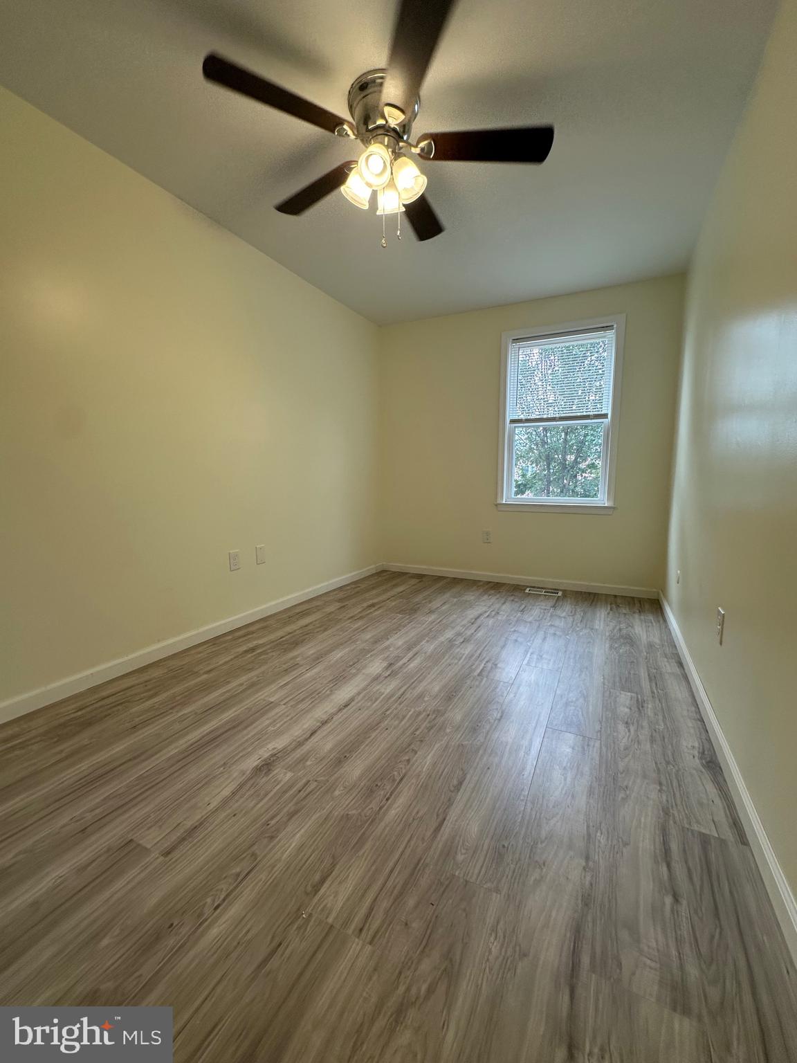 12070 Abby Road, Unit 1 Philadelphia, PA 19154 - Photo 15 of 22 wooden floor in an empty room with a window