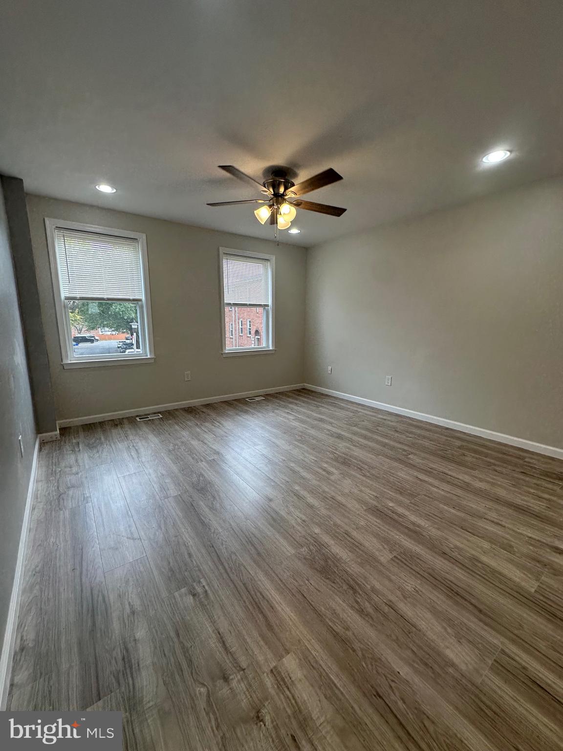 12070 Abby Road, Unit 1 Philadelphia, PA 19154 - Photo 19 of 22 wooden floor in an empty room with a window