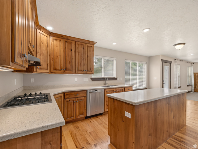 1279 West 1500th Street North Mapleton, UT 84664 - Photo 21 of 83 Kitchen featuring wood cabinetry with a natural finish, light-toned countertops, and wood-finish flooring
