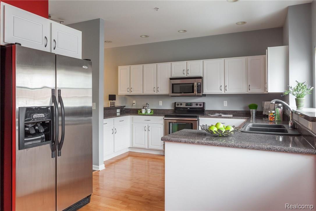 22694 Goddard Road Taylor, MI 48180 - Photo 2 of 13 Modern white kitchen with updated appliances and optimal counter space